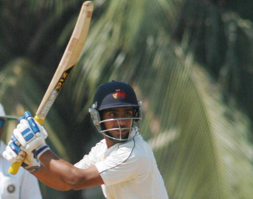 Mumbai's Iqbal Abdulla steers the ball through the off side