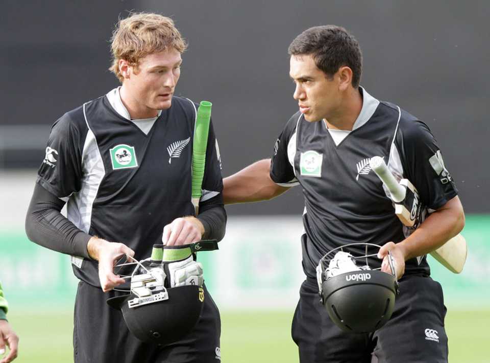 Martin Guptill and Ross Taylor walk back after the win