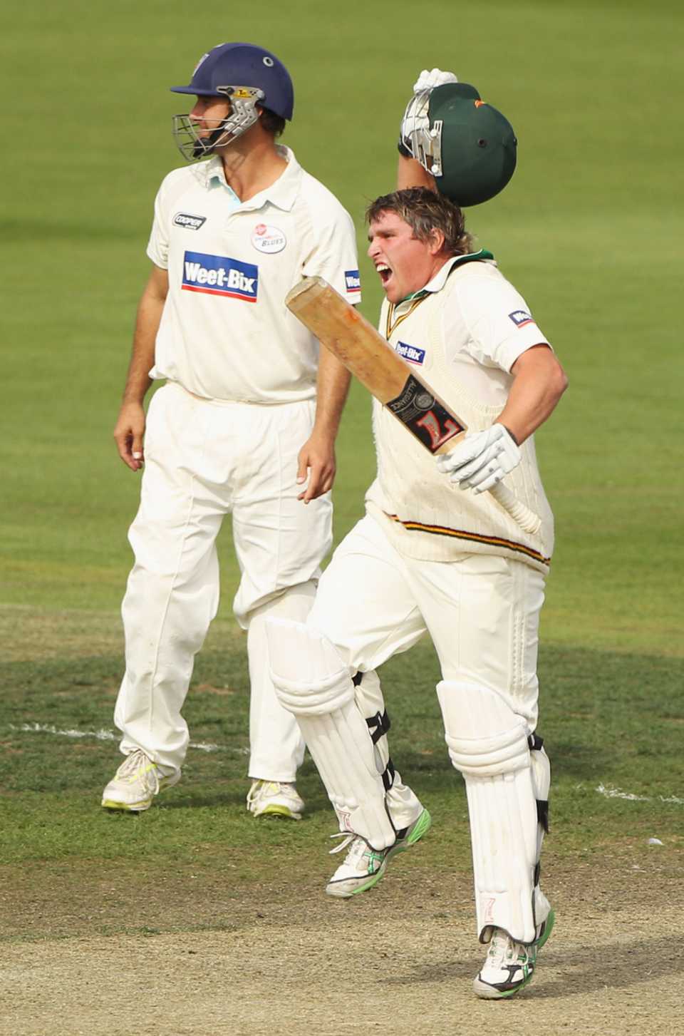 Mark Cosgrove celebrates hitting the winning runs against New South Wales