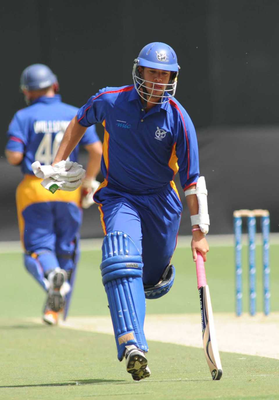 Namibia's Gerrie Snyman runs a single during his knock of 57