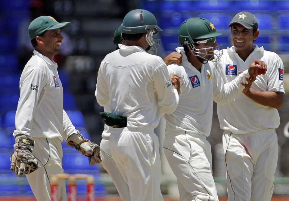 Umar Akmal is congratulated after taking a sharp catch to dismiss Ravi Rampaul, West Indies v Pakistan, 2nd Test, St Kitts, 5th day, May 24, 2011