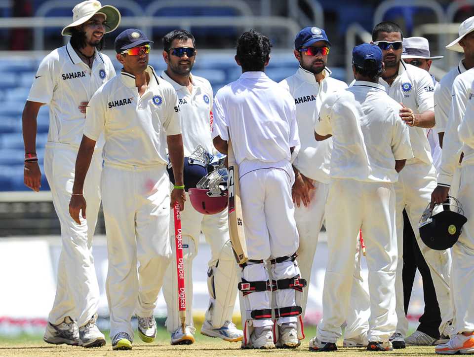 The Indian team walks off after completing the 63-run win