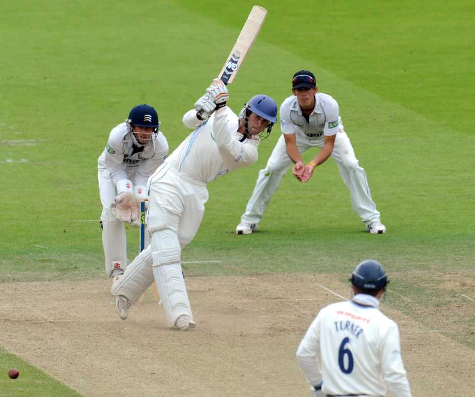 Ross Whiteley clips to leg during his fifty