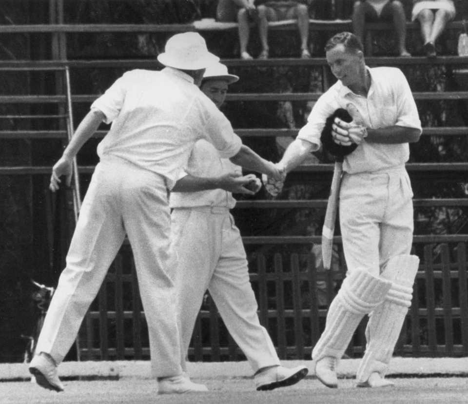 Trevor Goddard is congratulated by England captain Mike Smith for reaching his maiden Test century