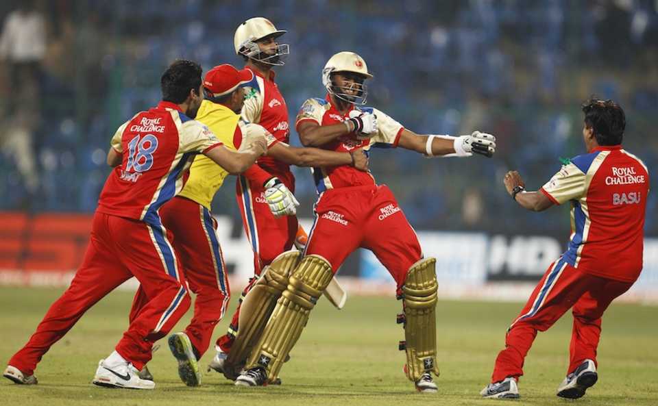 Royal Challengers Bangalore players rush to congratulate Arun Karthik, Royal Challengers Bangalore v South Australia, Champions League T20, October 5, 2011