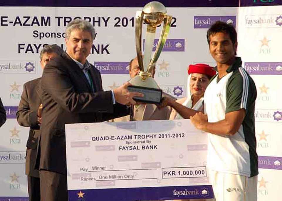 Pakistan International Airlines captain Kamran Sajid with the winners' cheque and trophy, Pakistan International Airlines v Zarai Taraqiati Bank Limited, Quaid-E-Azam Trophy Division One final, Karachi, 4th day, December 23, 2011