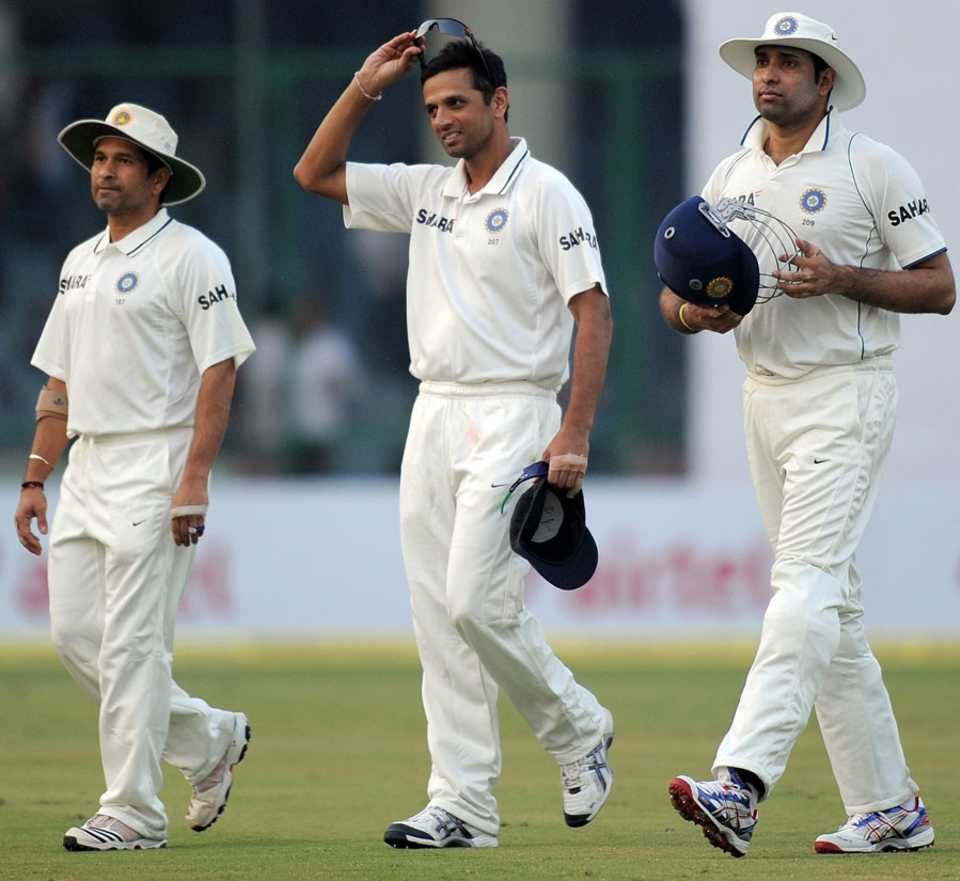 Sachin Tendulkar, Rahul Dravid and VVS Laxman walk off the field at the end of the day's play