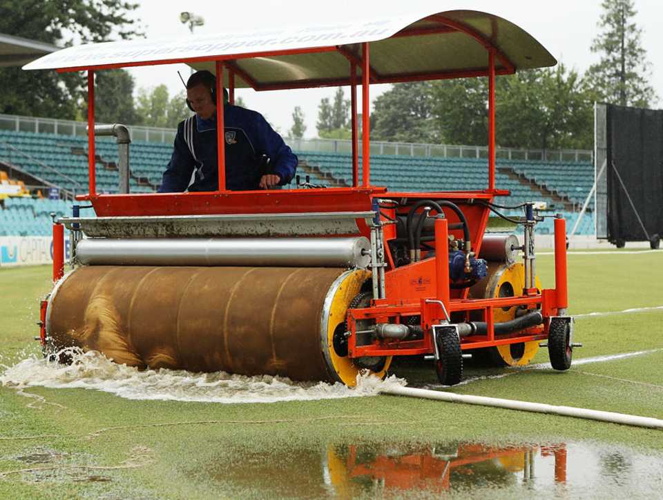 A super-sopper being used to dry the outfield