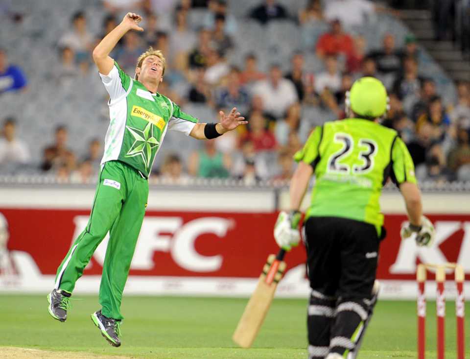 Shane Warne tries to field off his own bowling