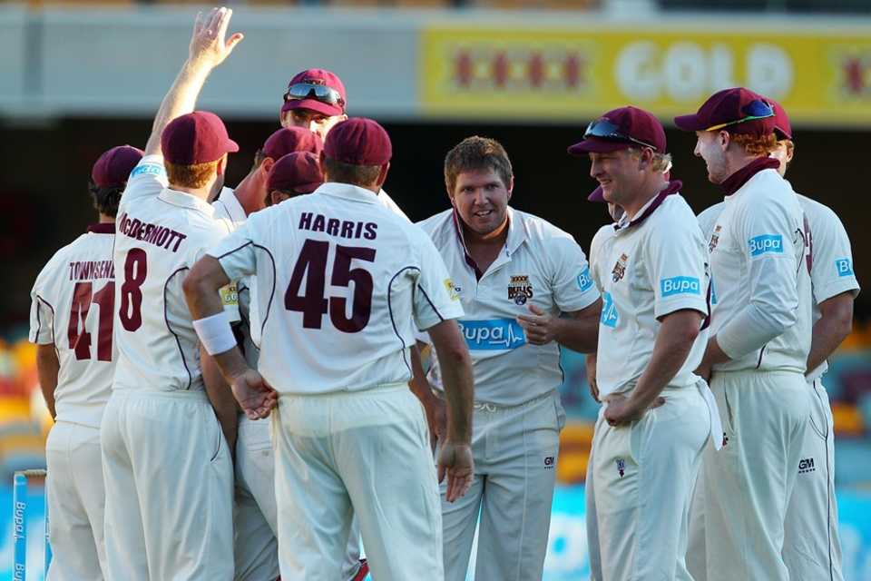 James Hopes and his Queensland team-mates celebrate a wicket, Queensland v South Australia, Sheffield Shield, 3rd day, March 10, 2012