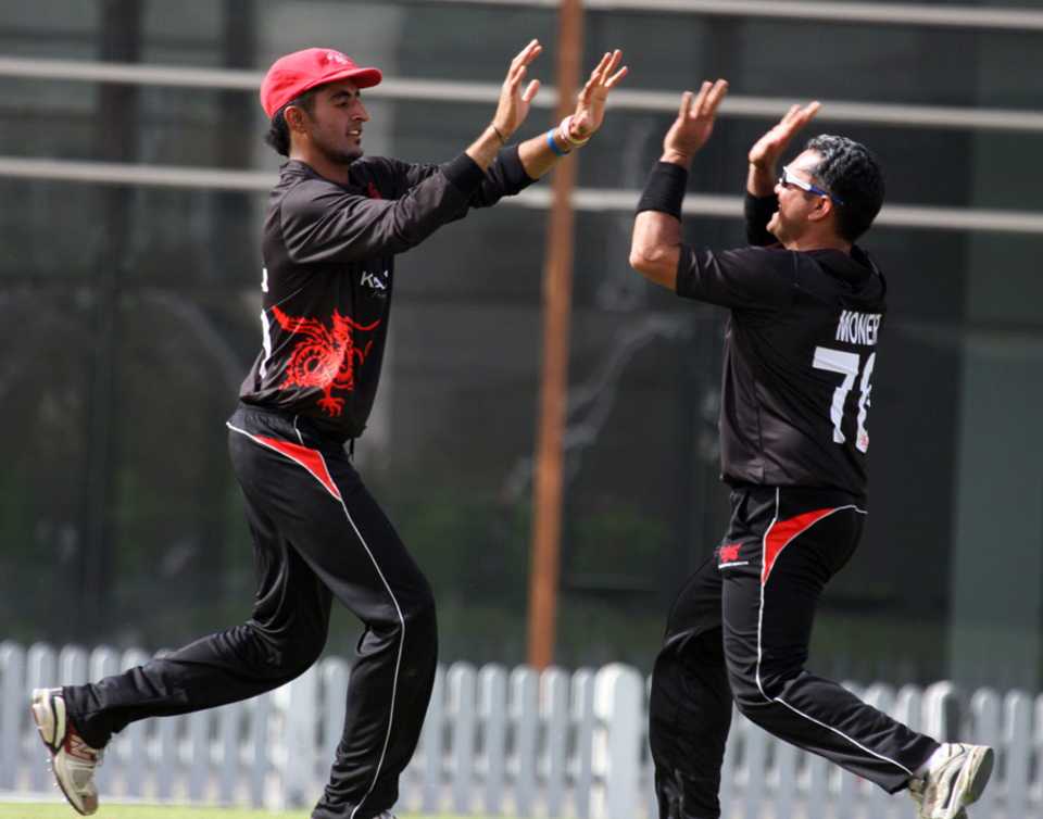 Nizakat Khan and Munir Dar celebrate a wicket for Hong Kong 