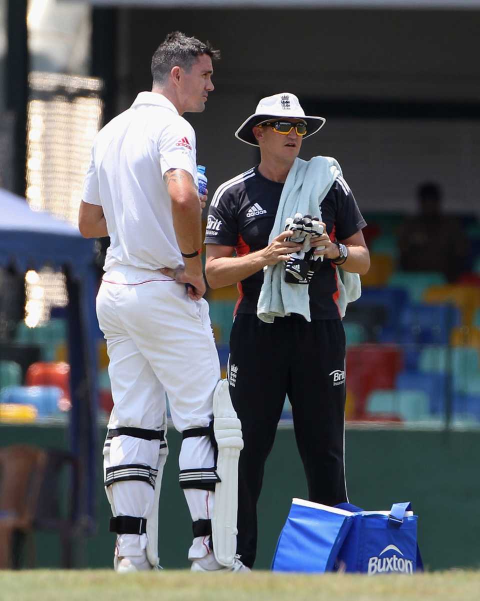 Kevin Pietersen takes a drink, with England coach Andy Flower acting as 12th man, Sri Lanka Development XI v England XI, Tour Match, 3rd day, March 22, 2012
