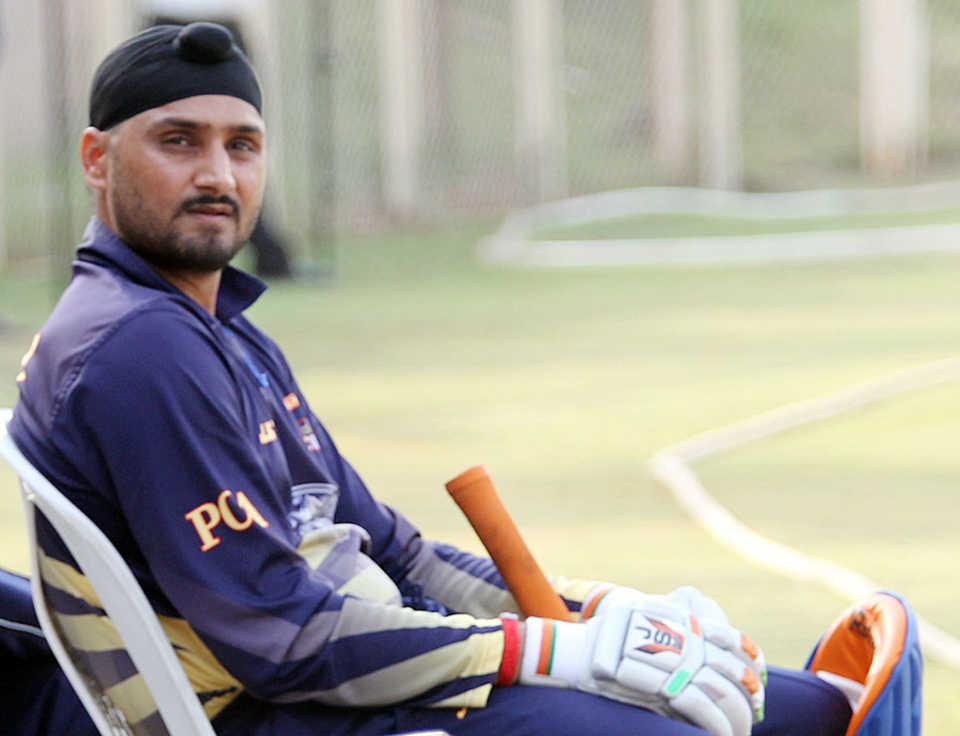 Harbhajan Singh awaits his turn to bat for Punjab