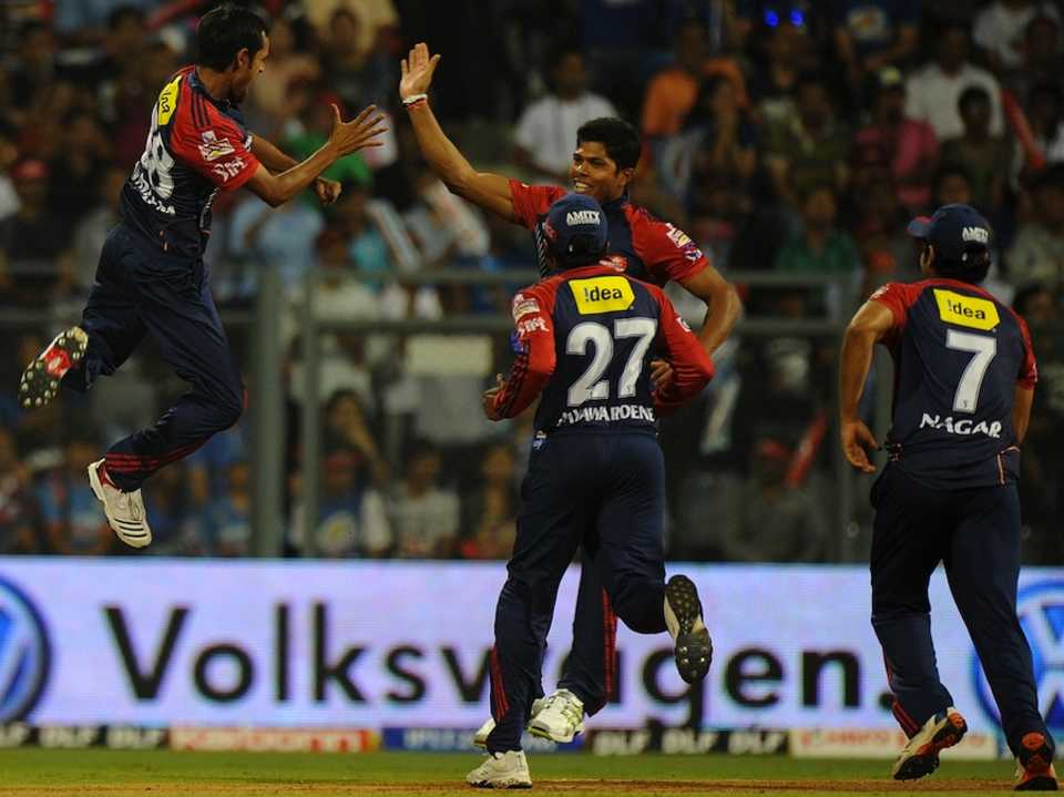 Shahbaz Nadeem celebrates the fall of a wicket with Umesh Yadav