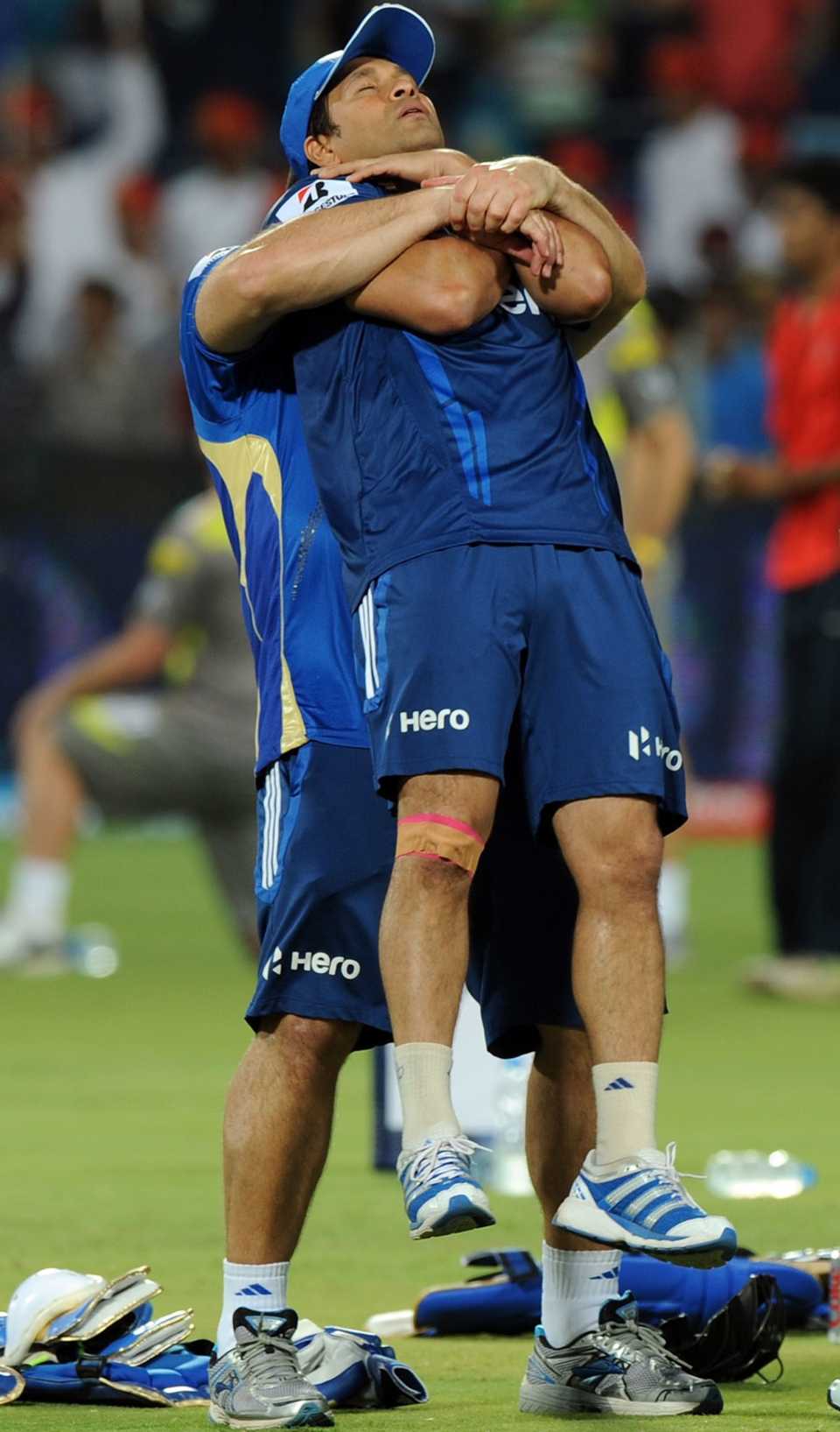 Sachin Tendulkar warms up with a trainer ahead of the match against Pune, Pune Warriors v Mumbai Indians, IPL, Pune, May 3, 2012