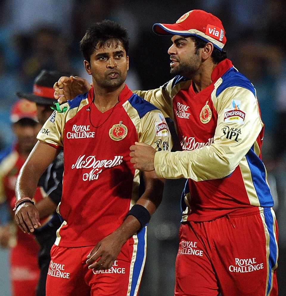 Vinay Kumar and Virat Kohli celebrate a wicket
