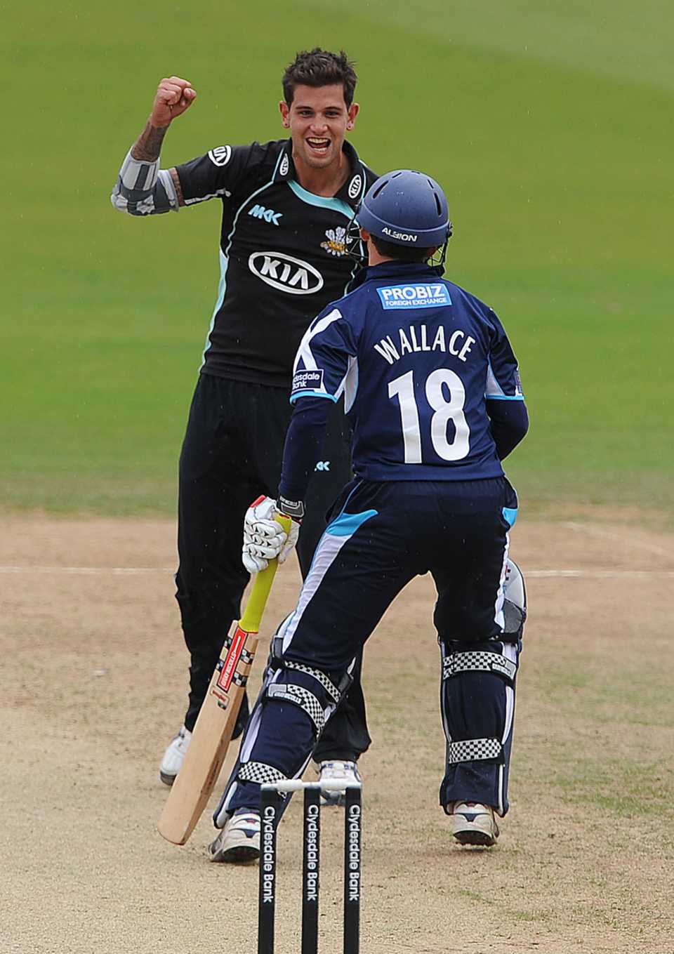 Jade Dernbach celebrates taking the wicket of Craig Wallace