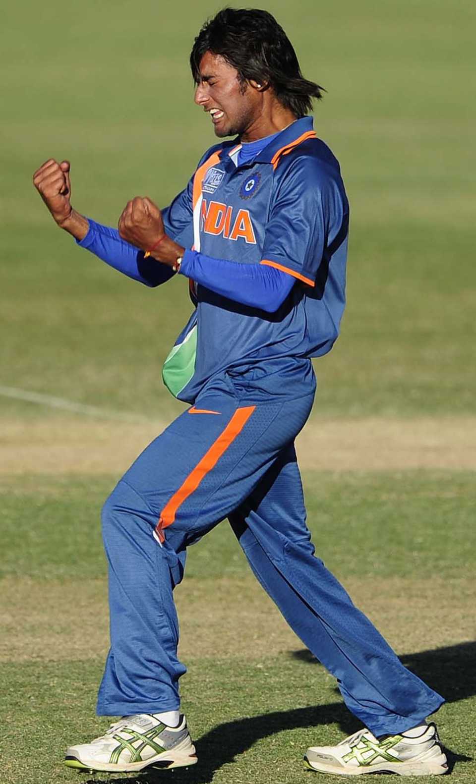 Kamal Passi reacts after taking a wicket