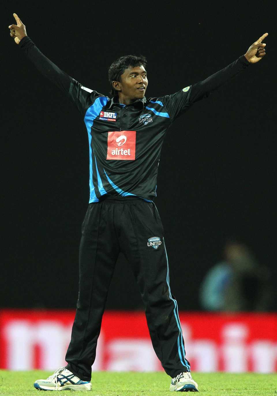 Akila Dananjaya celebrates one of his three wickets