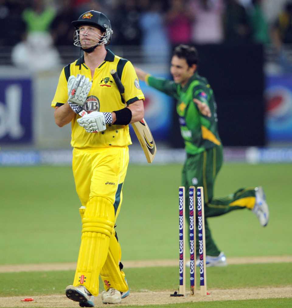 Cameron White walks off after being bowled by Saeed Ajmal
