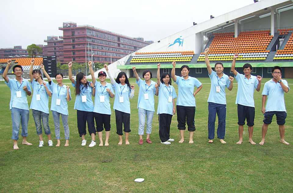 Student volunteers at the Guanggong International Cricket Stadium in Guangzhou