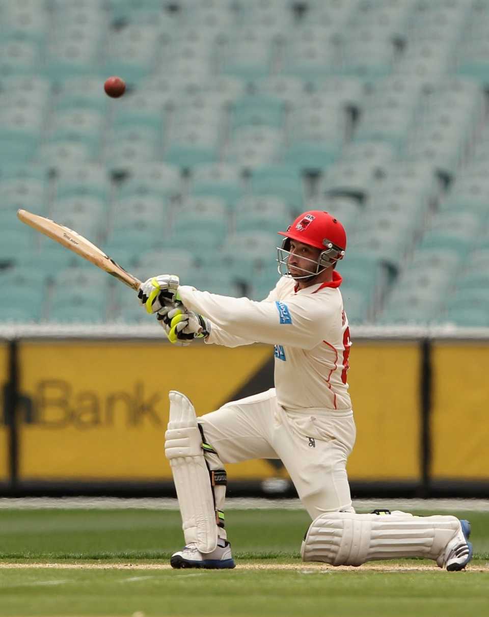 Phillip Hughes slashes through the off side