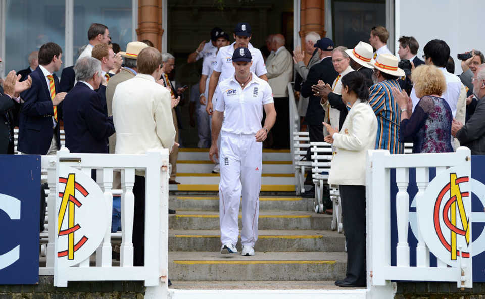 Andrew Strauss leads his team out