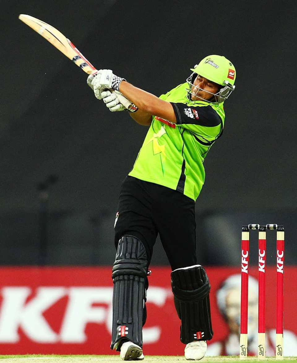 Usman Khawaja goes for a pull