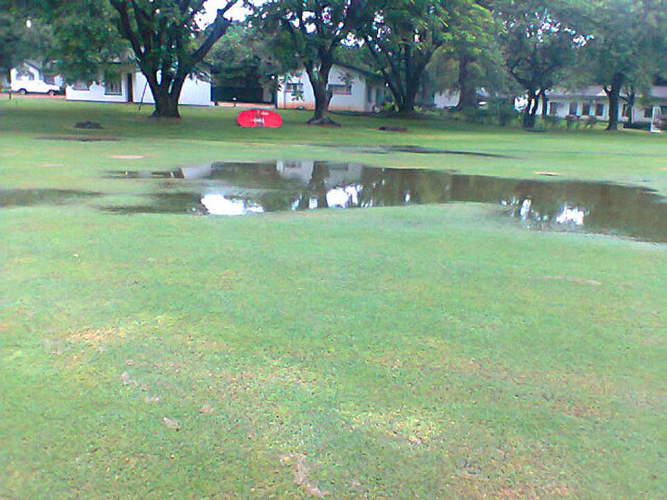 The wet outfield at Triangle Country Club
