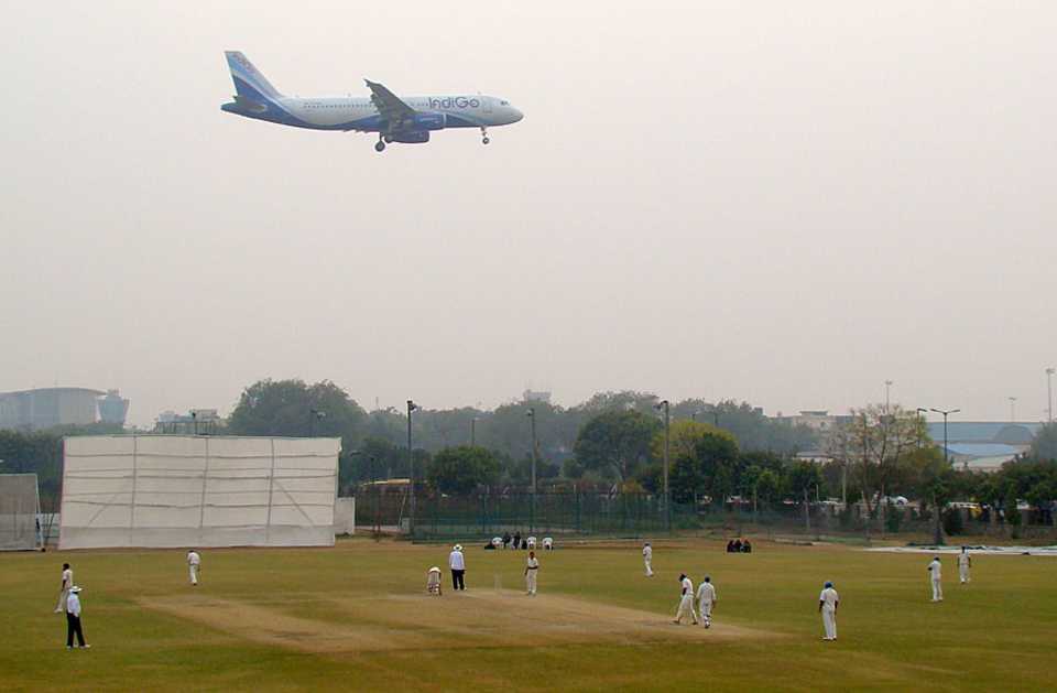 A plane prepares its descent over the Palam Ground, Services v Mumbai, Ranji Trophy 2012-13, 2nd semi-final, Delhi, 2nd day, January 17, 2013  
