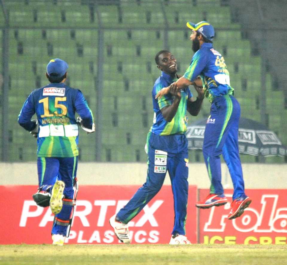 Elton Chigumbura is congratulated on taking a wicket