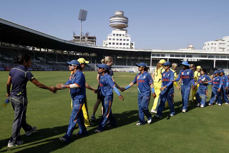 Players shake hands after Australia beat India by five wickets