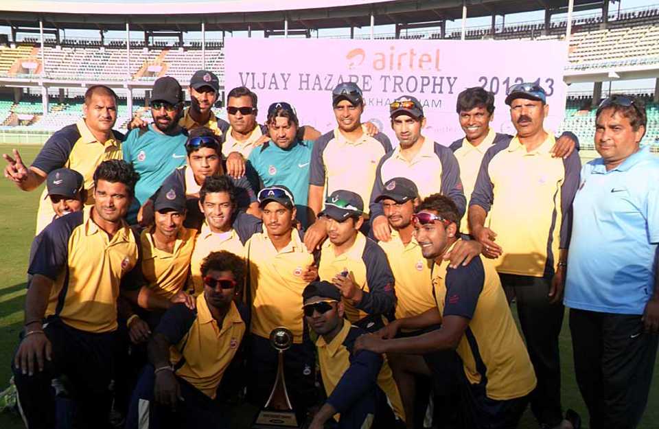 The victorious Delhi team with the Vijay Hazare Trophy