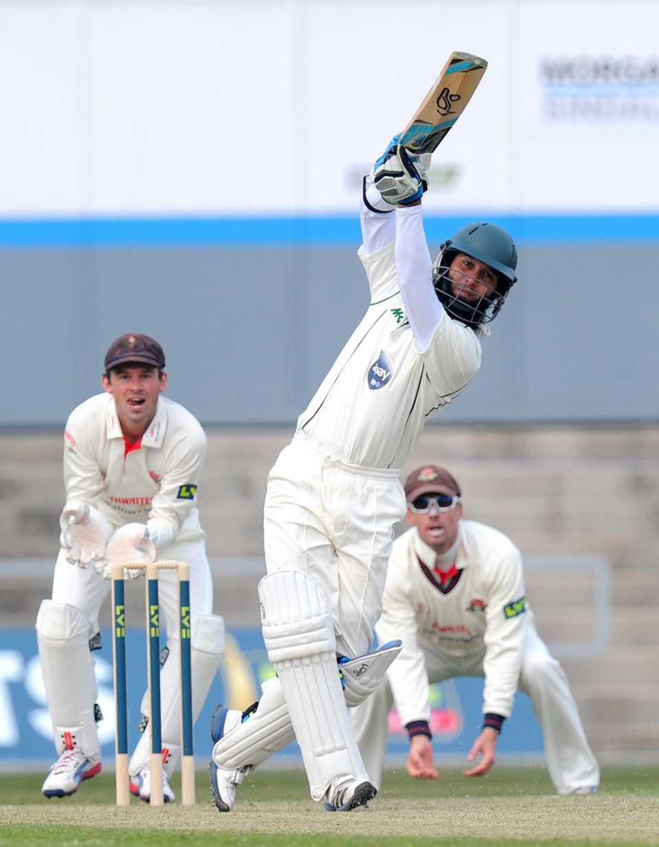 Moeen Ali goes down the ground on his way to a half-century