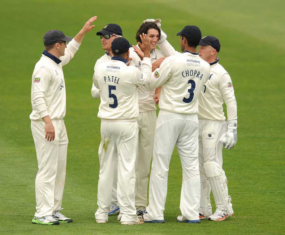 Chris Wright is congratulated on taking a wicket