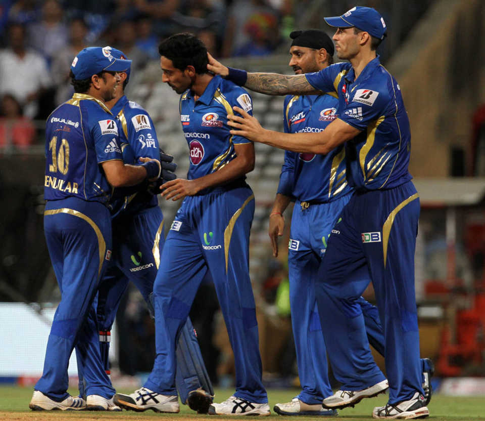 Dhawal Kulkarni is applauded by team-mates after his final over