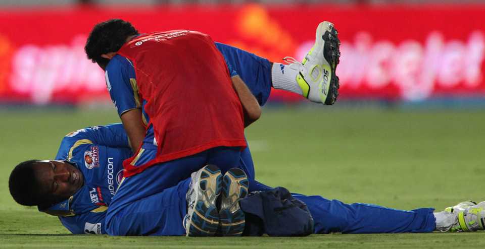 Kieron Pollard is tended to after injuring his finger, Sunrisers Hyderabad v Mumbai Indians, IPL, Hyderabad, May 1, 2013