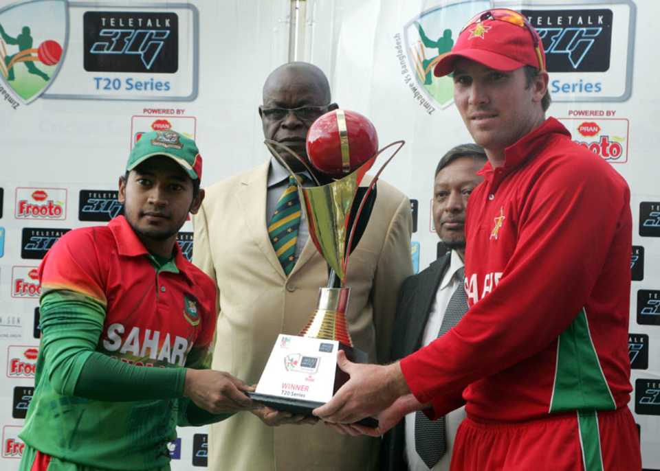 Mushfiqur Rahim and Brendan Taylor share the trophy after the series ended 1-1