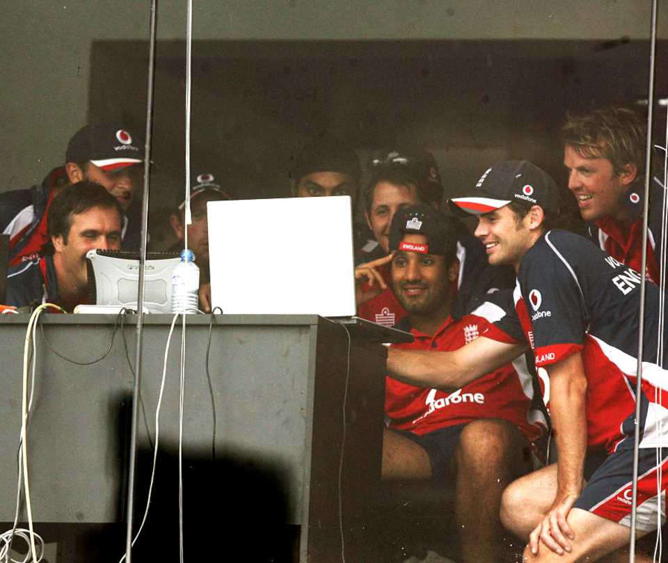 England players find entertainment on a laptop after play was called off due to rain