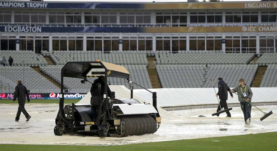 Groundsmen try to clear water from the pitch, Australia v New Zealand, Champions Trophy, Group A, Edgbaston, June 12, 2013