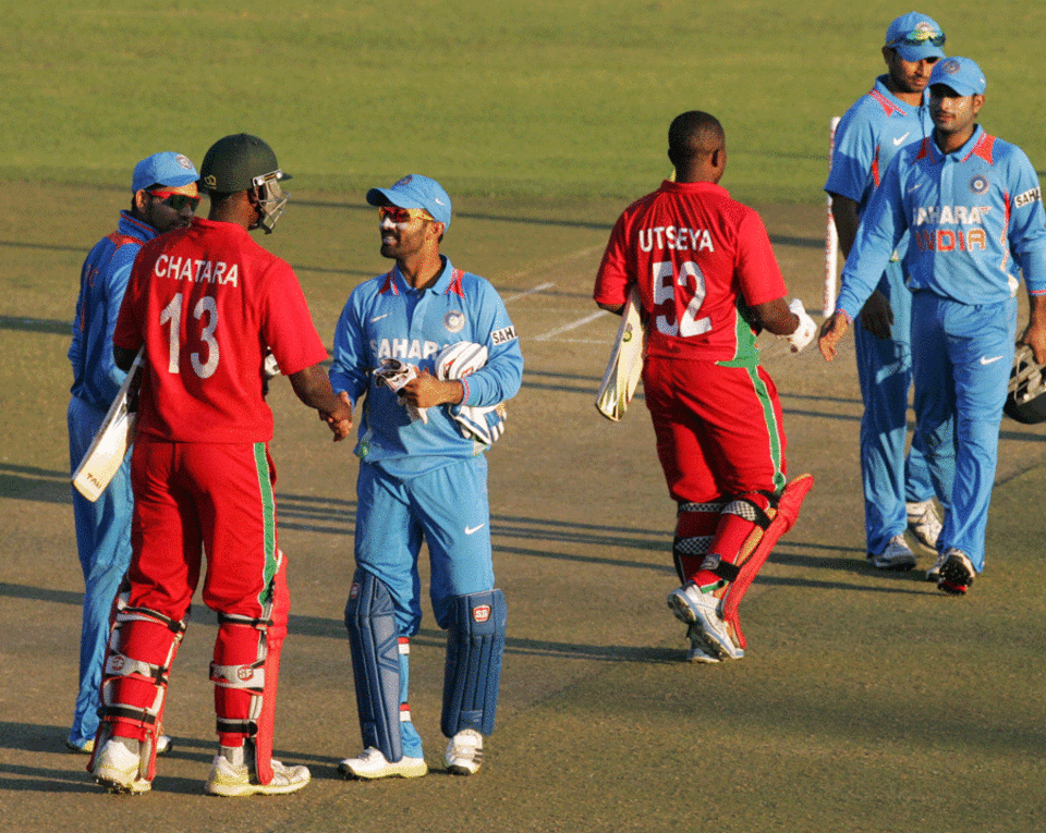 The Indian team is congratulated after their victory over Zimbabwe
