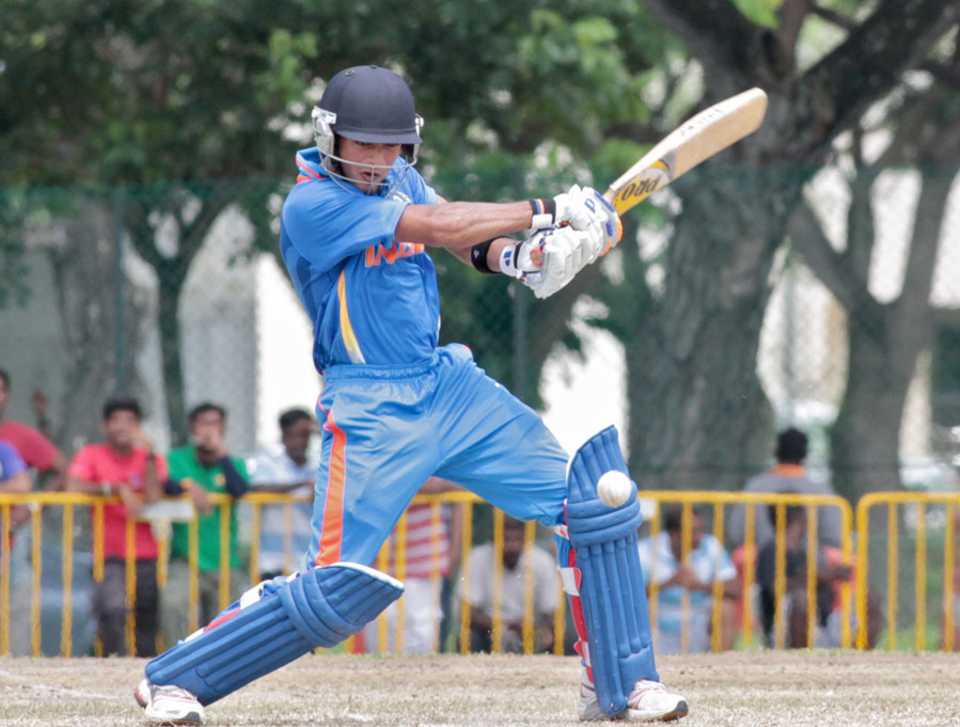 Unmukt Chand plays an attacking shot on the off side