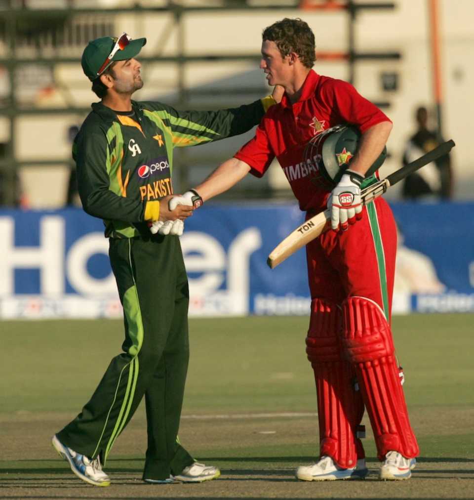 Ahmed Shehzad congratulates Sean Williams after the match