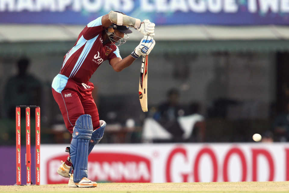 Kumar Sangakkara defends one back to the bowler