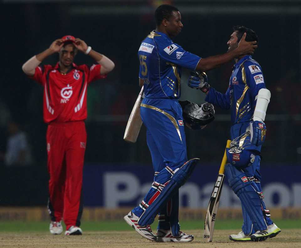 Dinesh Karthik and Kieron Pollard celebrate Mumbai Indians' win