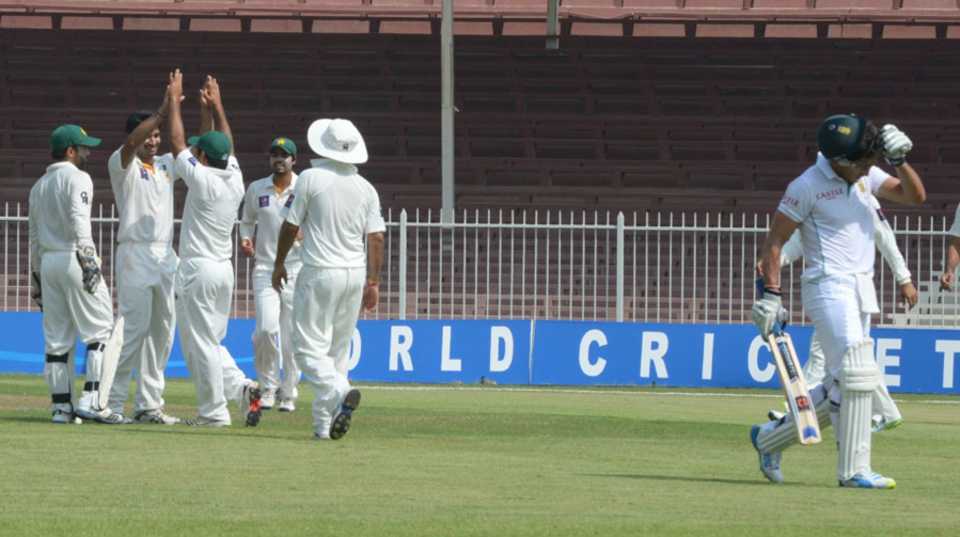 Pakistan A players celebrate the dismissal of Faf du Plessis