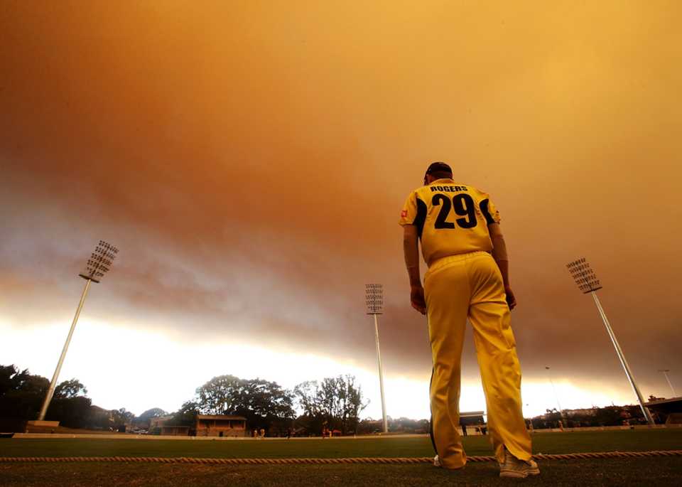 John Rogers watches play under a smoke cloud caused by New South Wales' bushfires, South Australia v Western Australia, Ryobi Cup, Sydney, October 17, 2013