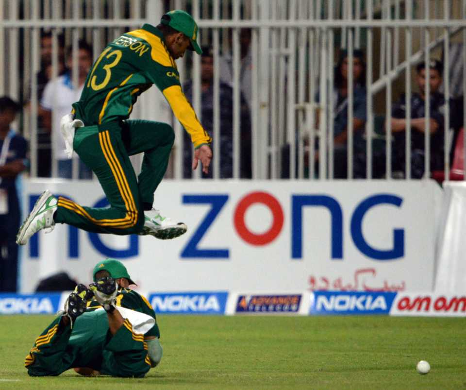 Robin Peterson leaps over a team-mate to stop a ball in the field, Pakistan v South Africa, 5th ODI, Sharjah, November 11, 2013