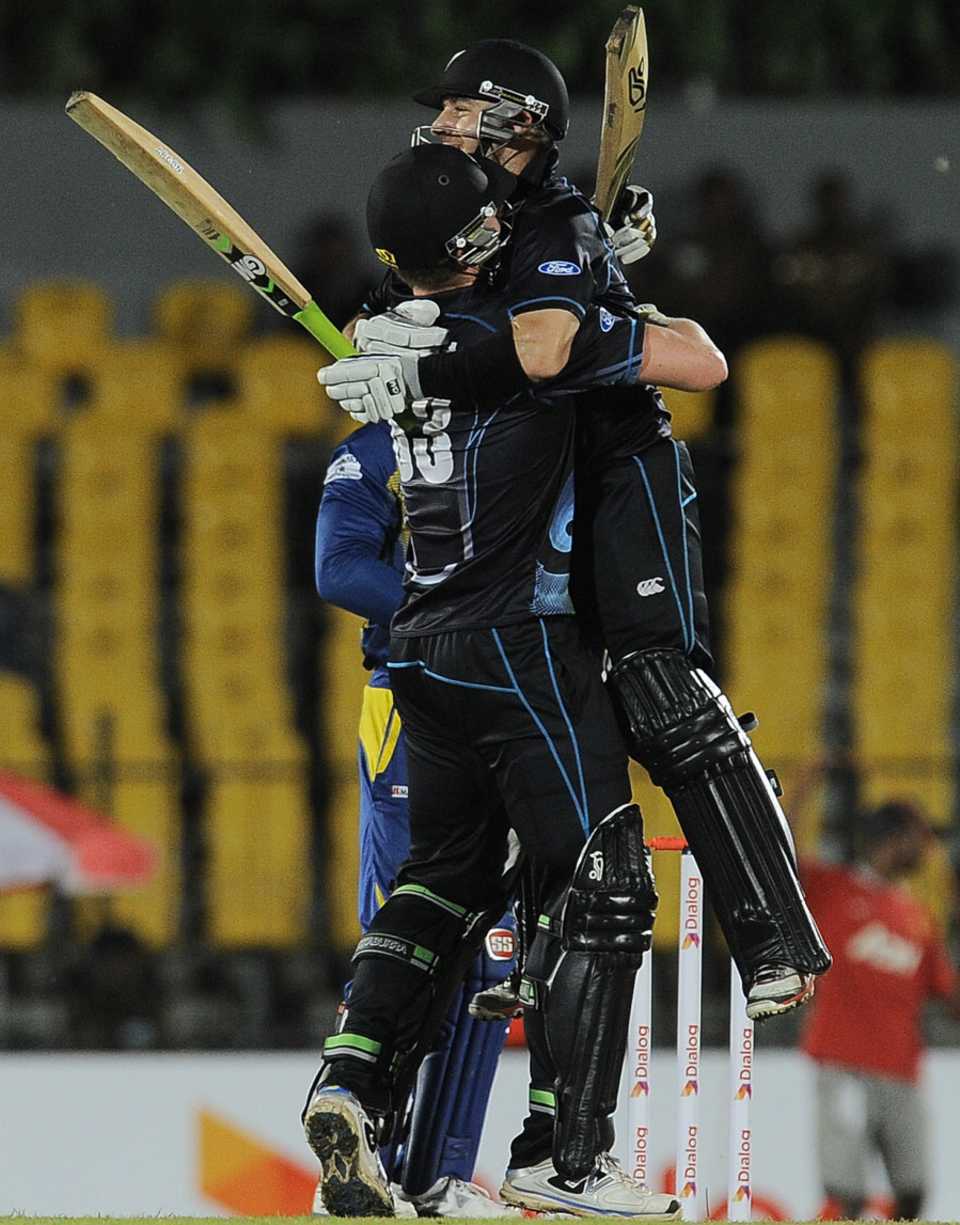 James Neesham and Nathan McCullum embrace after the latter hit the winning run with a six off the final ball