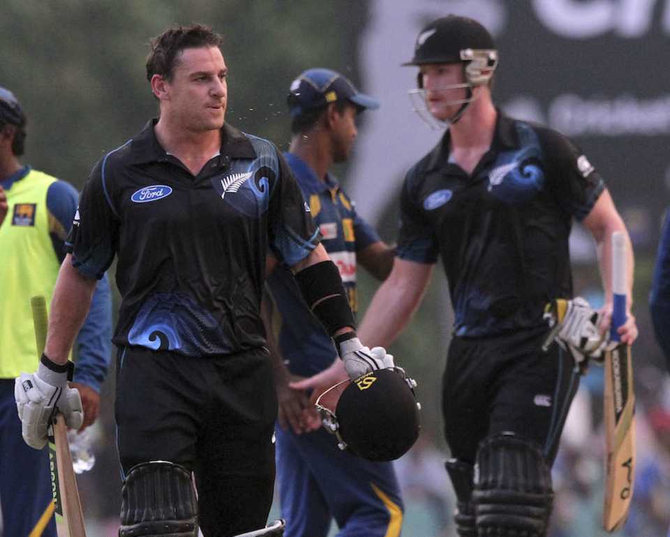 Nathan McCullum and James Neesham leave the field disappointed
